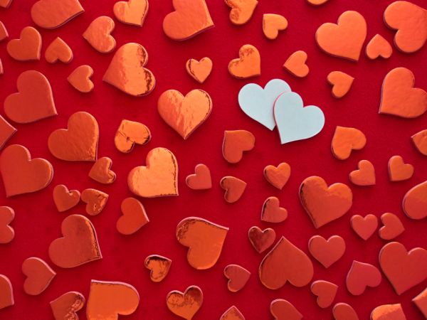 20 Valentine's Day Date Ideas Beyond Dinner – Valentine hearts on red background